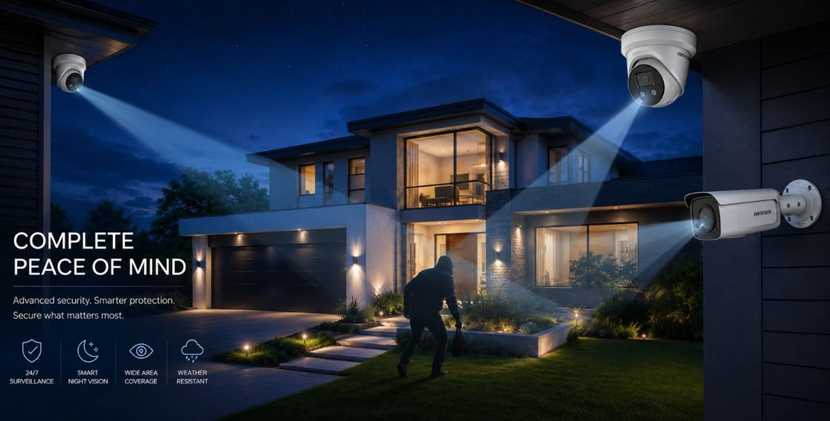 Modern home at dusk protected by Hikvision AcuSense turret and bullet cameras